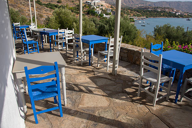 istock Tables and chairs above Mirabello Bay in Crete 492600706