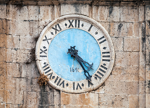 Ancient clock tower of central Saint Nicholas Church, Perast town, Montenegro