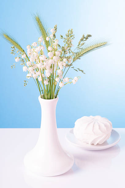 istock Lilies in a white vase and a zephyr 492601951
