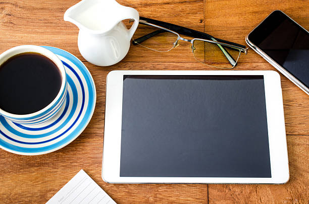 istock tablet pc and a coffee and Mobile phone 492601957