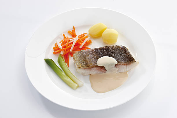 Cobia, fish filet, boiled potatoes, carrots, onion springs, whit
