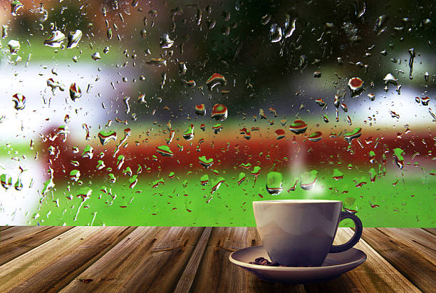istock cup of coffee and window 492604188