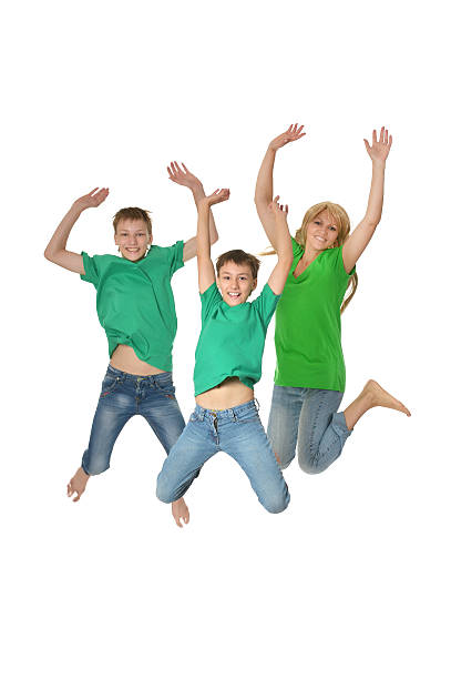 istock Mother and sons jumping in studio 492605454