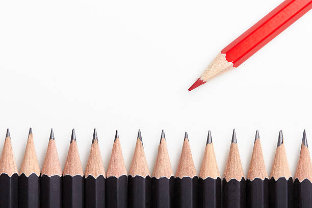 istock Red pencil standing out from crowd 492605506