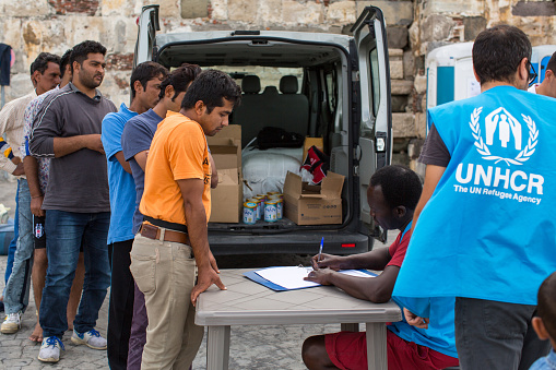 Kos, Greece - September 27, 2015: War refugees are registered employees of the UNHCR. Kos island is located just 4 kilometers from the Turkish coast, and refugees come from Turkey on inflatable boats.