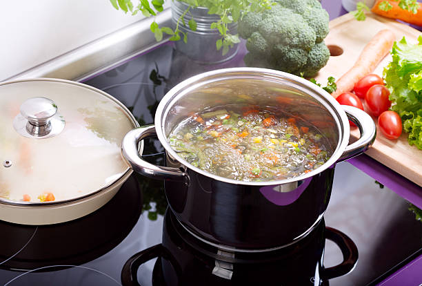 istock pan of vegetable soup in the cooker 492608972