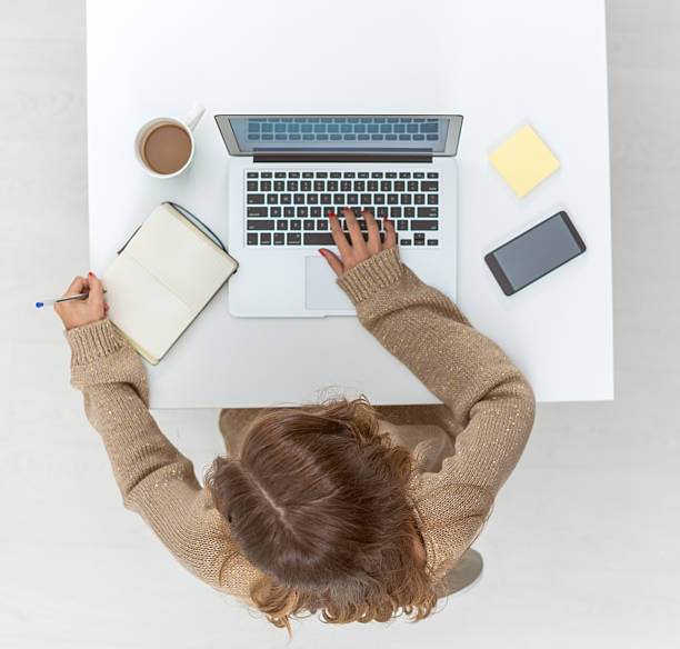 istock Casual woman workin on laptop 492609350
