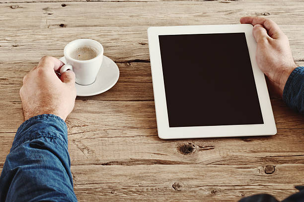 istock male hands holding a tablet computer with blank screen closeup 492611590