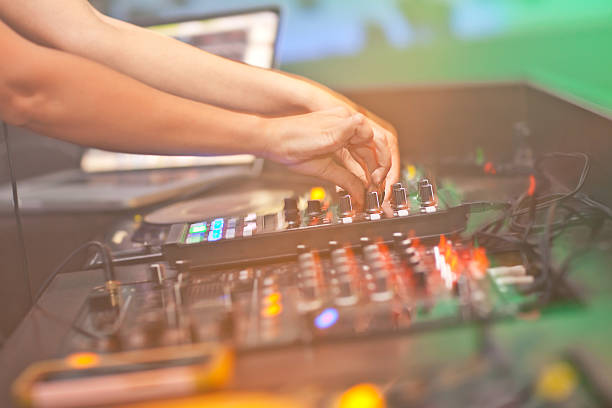 istock DJ mixing music on console at the night club 492618256