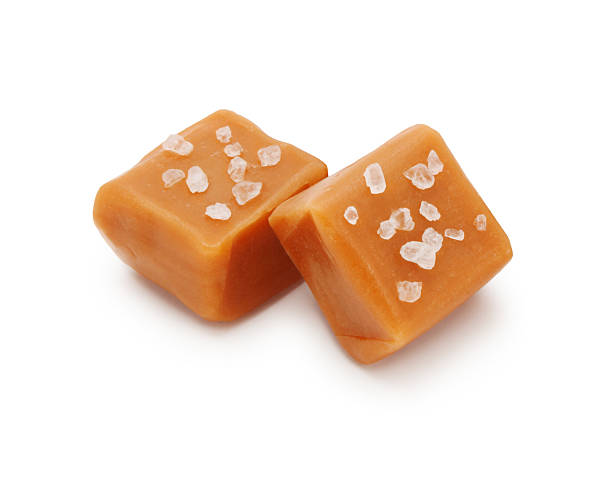 Salted Caramel Candies Salted Caramel Candies isolated on white fudge stock pictures, royalty-free photos & images