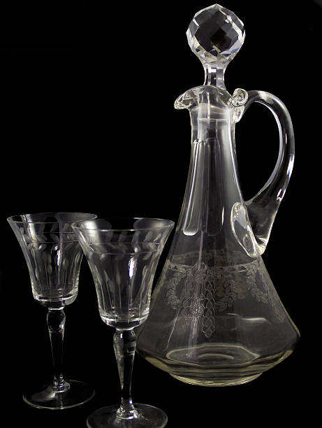 istock Old bottle and glasses in black. 492624845