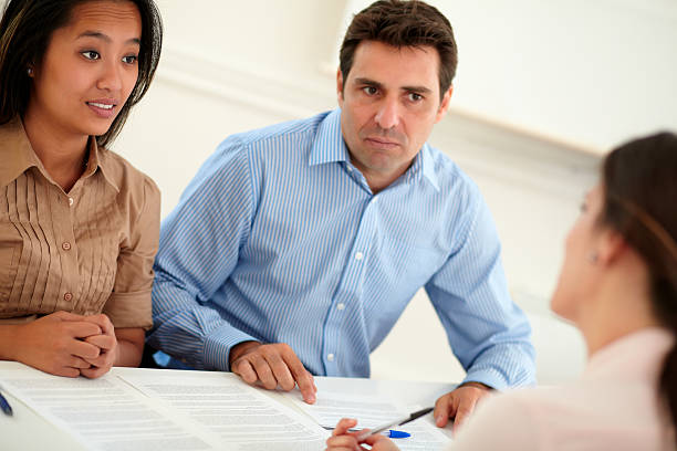 istock Ethnic couple interested in a contract 492625059