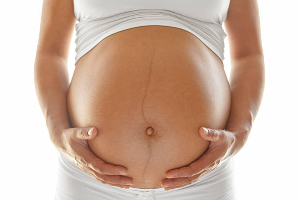 istock Pregnant woman holding her belly 492626286