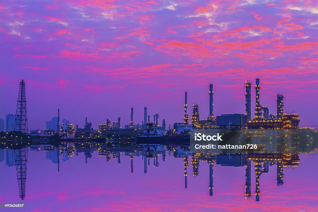 Oil refinery Refinery in the morning. Chimney Stock Photo