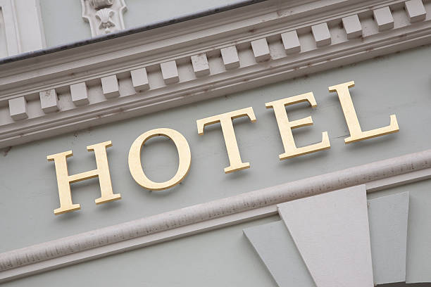 istock Gold Hotel Sign on White Wall Background 492627163