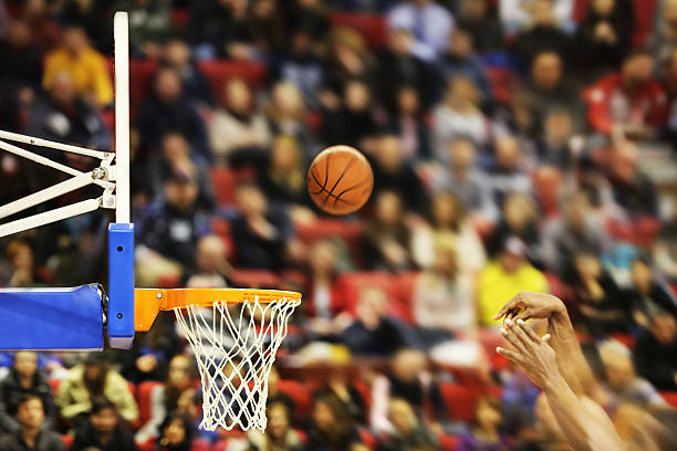 Scoring the winning points at a basketball game Scoring the winning points at a basketball game , motion blur acute angle photos stock pictures, royalty-free photos & images