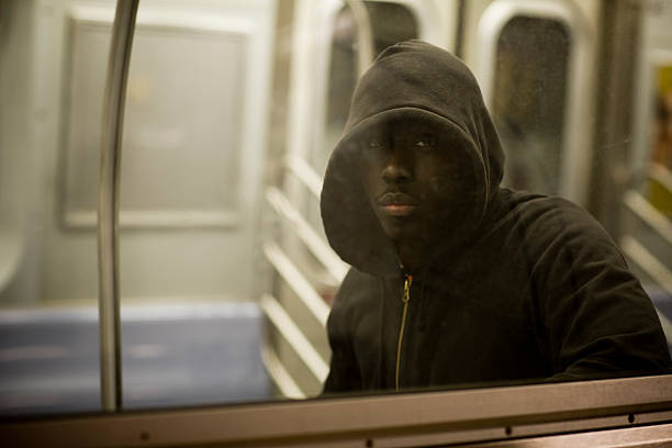 istock African American Young Man Portrait on Subway Through Window, Copyspace 492630084
