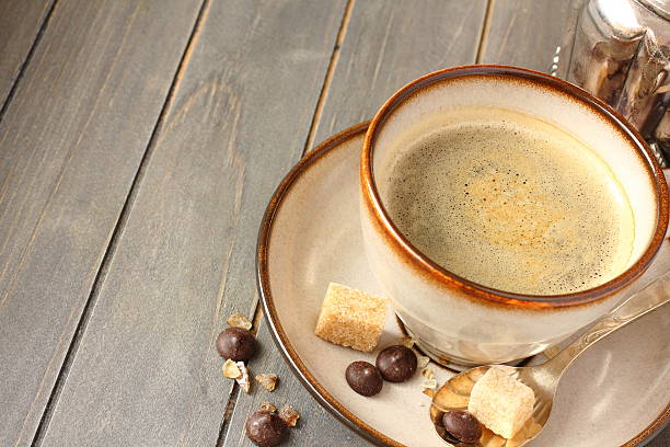 istock Cup of coffee, sugar cubes and chocolate drops 492630157