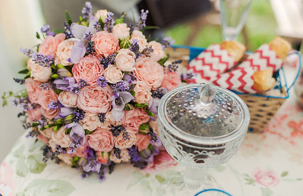 istock Served table outdoors. Flower arrangement with lavender and roses 492630670