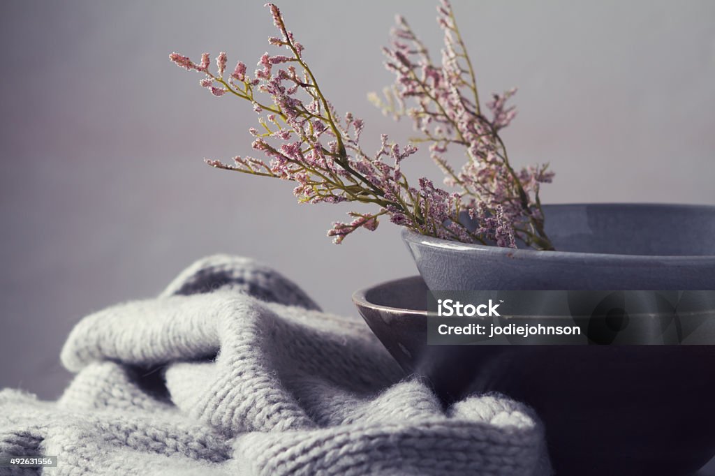 Still life gray vintage bowls with flowers horizontal Still life gray vintage bowls with pink flowers and woolen scarf horizontal Still Life Stock Photo