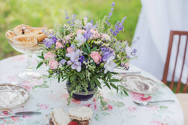 istock Served table outdoors. Flower arrangement with lavender and roses. Wedding 492632052