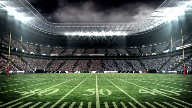 https://media.istockphoto.com/id/492640296/video/view-of-an-american-football-stadium.jpg?s=640x640&amp;k=20&amp;c=6mXBjX4q6tr2EbF-iUCkeGWb8ePaSZbJD5MSAx3Z4Sg=