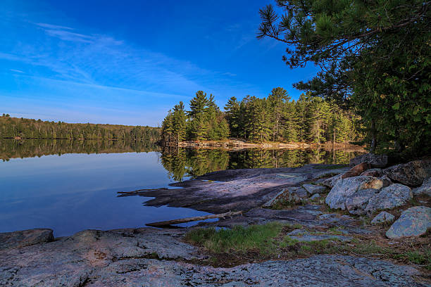 istock Clear blue sky and mirror like lake 492641696