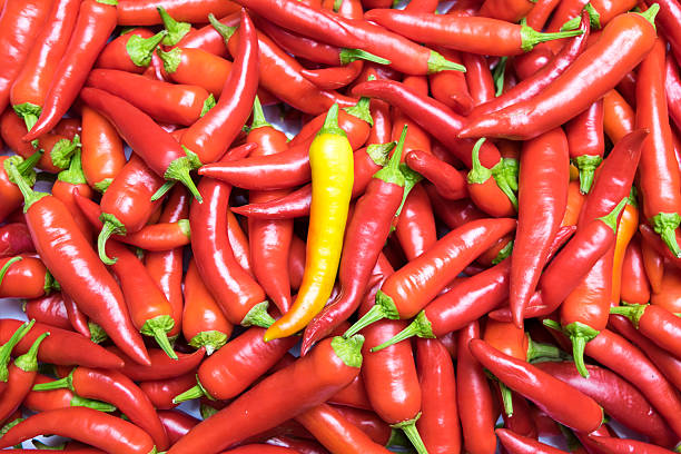istock Red and green hot chill peppers background 492643496