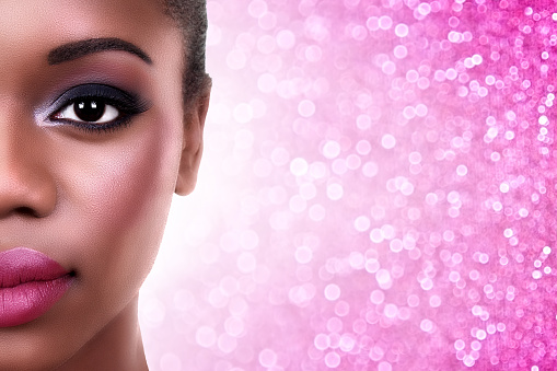 Beautiful African American woman with smokey eye make up and copy space