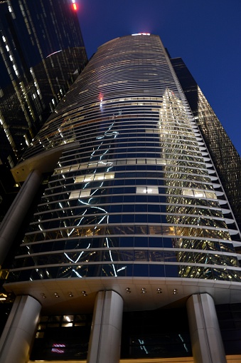 Hong Kong, Hong Kong - April 9, 2014: Citibank Plaza, low angle view at night. It's a modern office complex and comprises Citibank Tower, ICBC Tower and a retail podium. Citibank Plaza is one of the biggest office complexes in Hong Kong, Citibank Tower is 205 mt tall. 