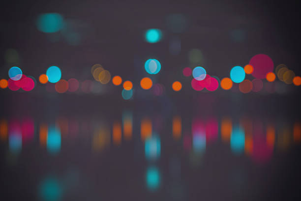 istock Blurred city lights with bokeh on water 492646020