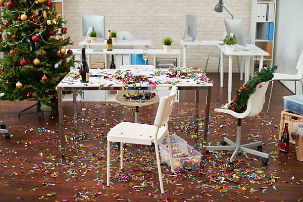 Mess in the office Office interior with confetti on the floor christmas chaos stock pictures, royalty-free photos & images