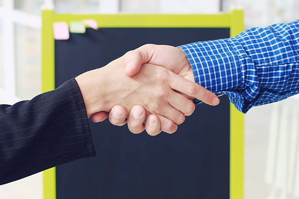 Close-up image handshake standing for a trusted partnership . stock photo