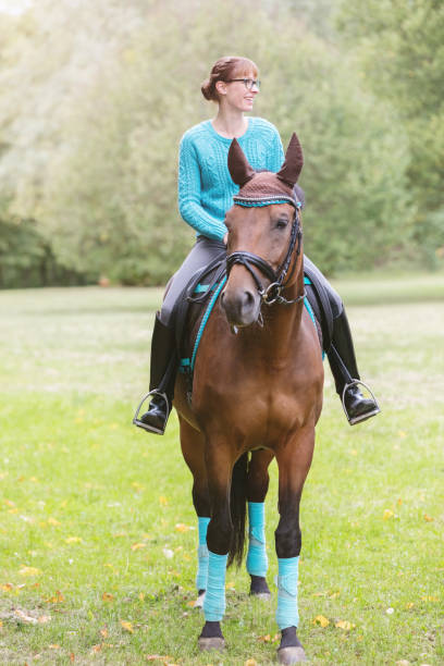 istock Woman riding her horse 492650426