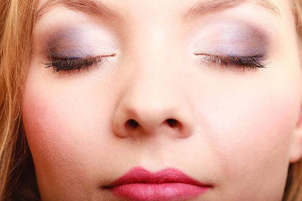 istock Closeup beautiful female eyes with make-up visage. 492651576