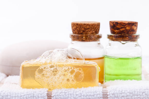 istock Herbal spa soap bar on white bath towel . 492653884