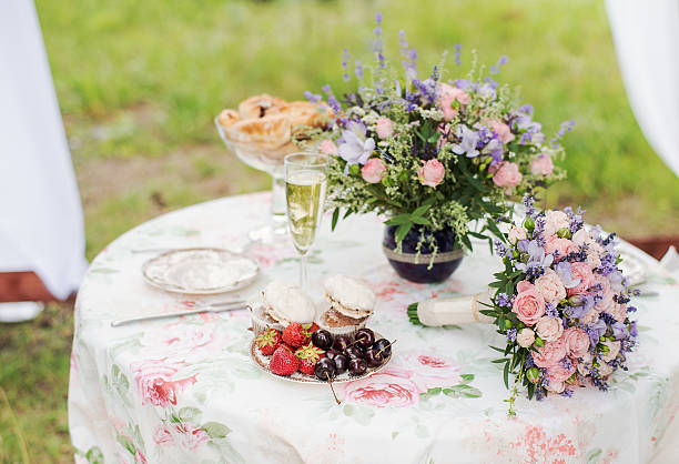 istock Served table outdoors. Flower arrangement with lavender and roses. Wedding 492654104