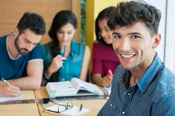 Smiling Student Looking At Camera Stock Photo - Download Image Now - Lecture Hall, Latin American and Hispanic Ethnicity, University Student - iStock