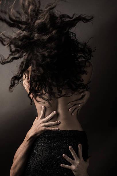 istock Back of woman with male hands 492654982