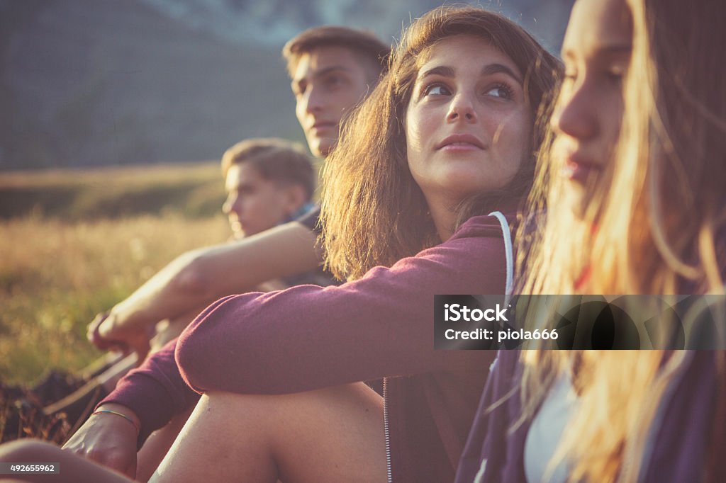Teenager friends portrait at sunset A group of teenage friends, adventures on the mountain, on the Italian Dolomites. Nature Stock Photo
