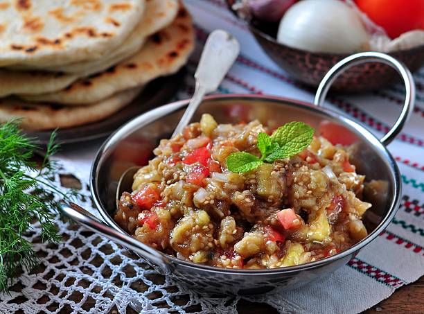 istock Eggplant caviar (salad) with tomato, white onion, olive oil 492664868