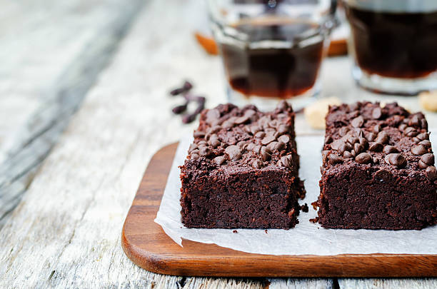 red beans chocolate chips brownie red beans chocolate chips brownie on a white wood background. toning. selective focus red bean dessert stock pictures, royalty-free photos & images