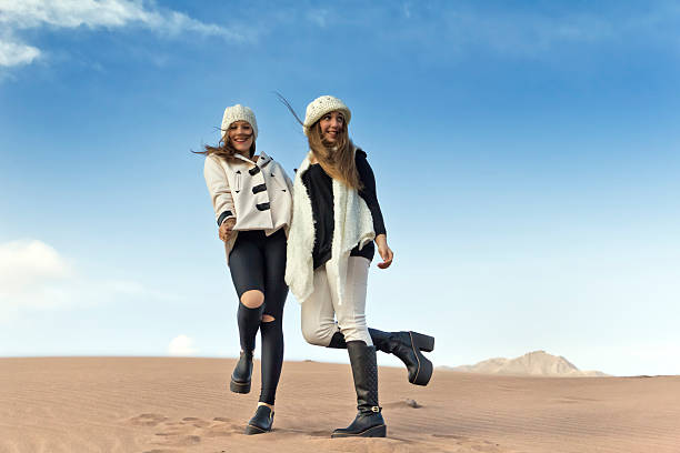 Teens enjoying the fashion sesion in the desert.