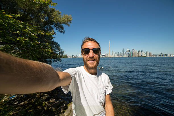 istock One young man taking selfie portrait in Toronto 492668654