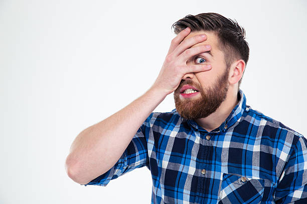 istock Man covering his face with palm 492669148