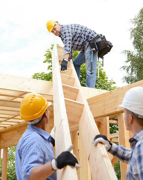 istock team of builders build frame house 492671678