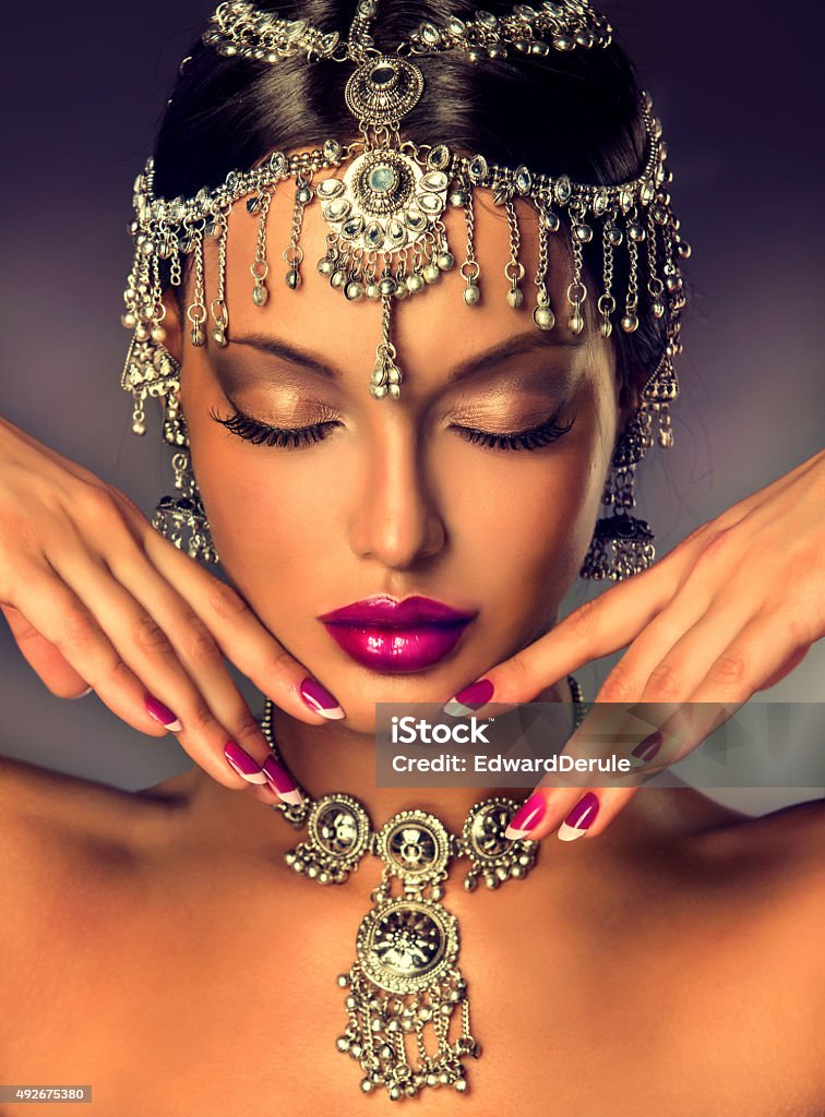 Indian women with closed eyes. Beautiful Indian women portrait with jewelry  2015 Stock Photo