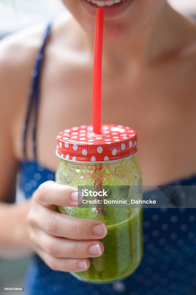 Women drinking green juice 2015 Stock Photo
