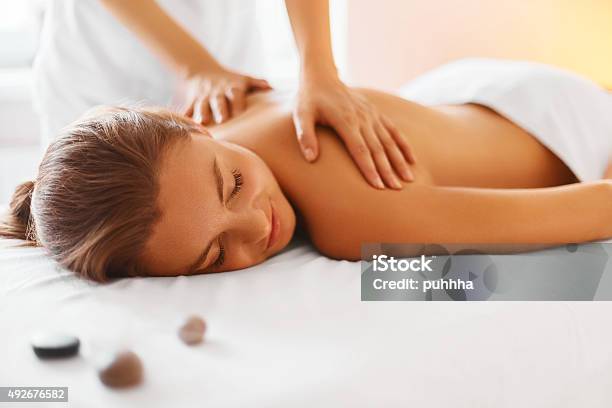 Spa Woman Female Enjoying Massage In Spa Centre Stock Photo - Download Image Now - Massaging, Spa Treatment, Relaxation