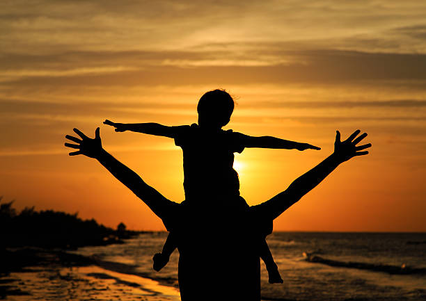 istock father and son having fun at sunset 492676946